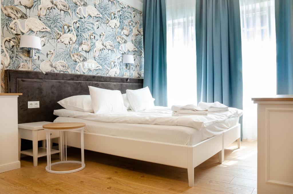 En eller flere senger på et rom på Hotel Villa Baltica