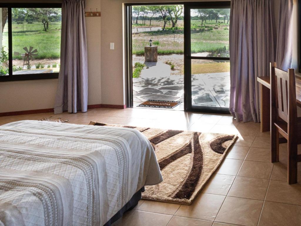 Africa Awaits Lodge & Safaris - Habitación Gemela De Lujo