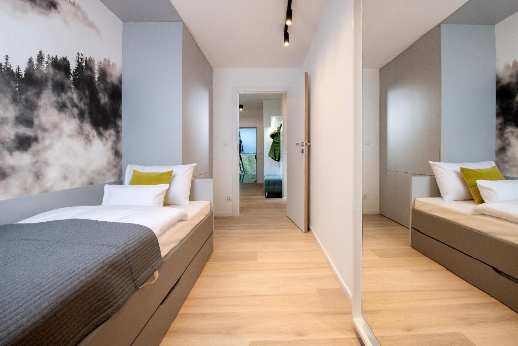 Postel nebo postele na pokoji v ubytování VISLOW Resort