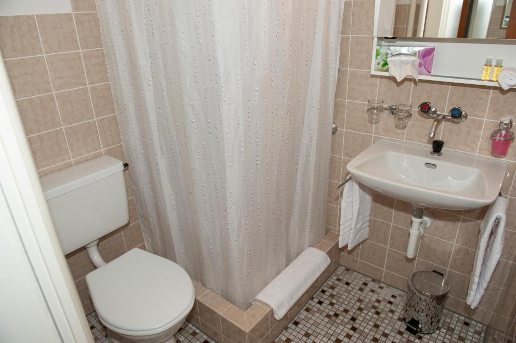 Koupelna v ubytování Hotel Sporting