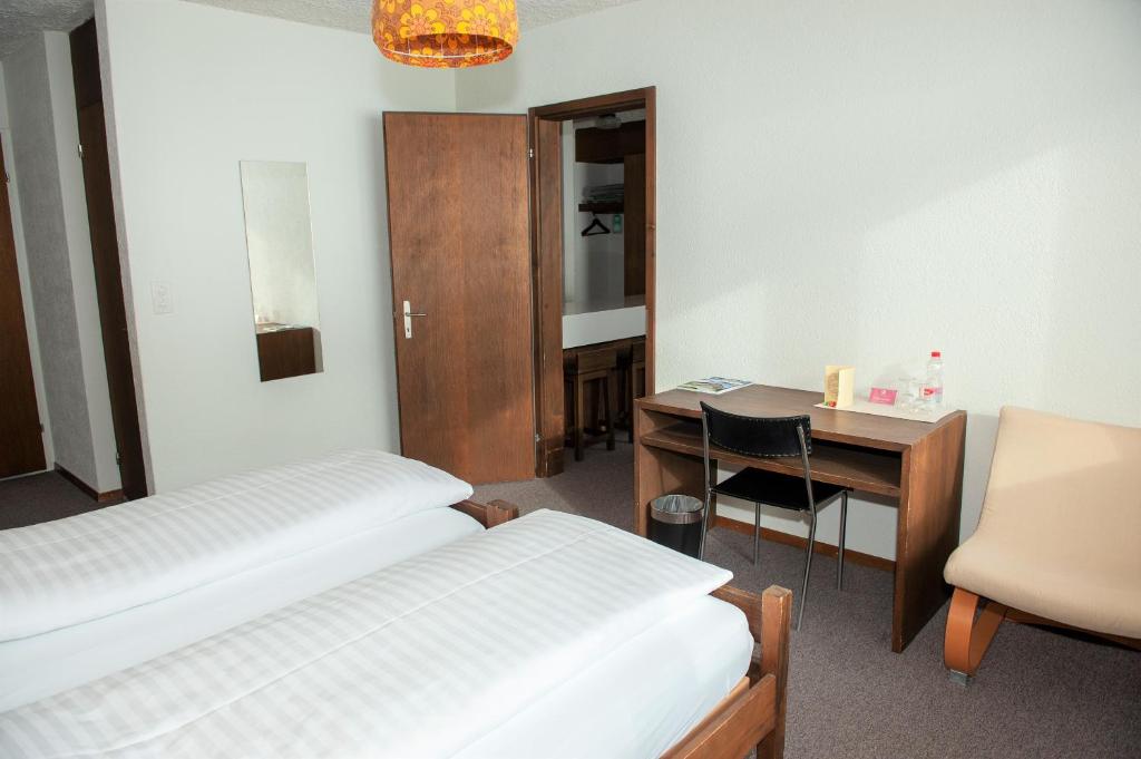 Postel nebo postele na pokoji v ubytování Hotel Sporting