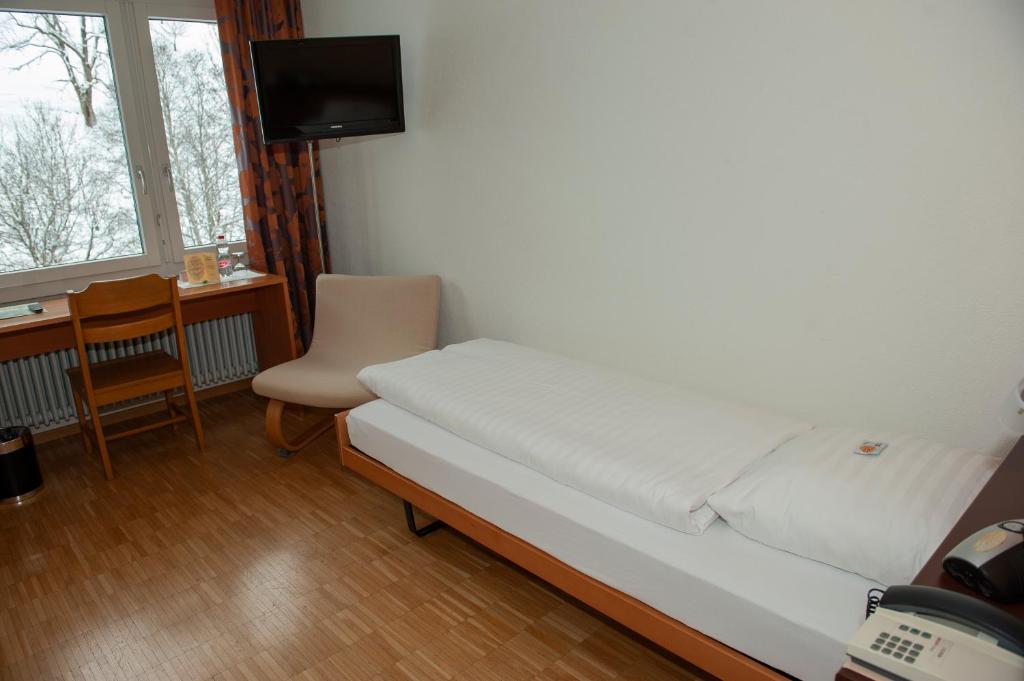 Postel nebo postele na pokoji v ubytování Hotel Sporting