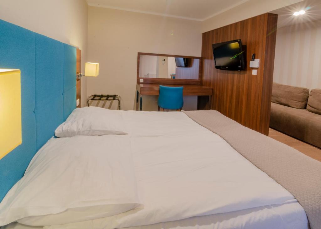 Posteľ alebo postele v izbe v ubytovaní Holiday Home Aparthotel z balkonem przy plaży