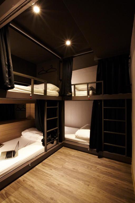 Postel nebo postele na pokoji v ubytování Main Inn Taipei