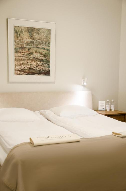 Postel nebo postele na pokoji v ubytování Hotel Vanilla