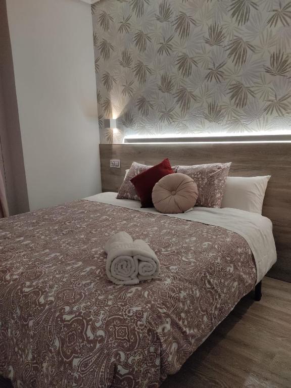 Postel nebo postele na pokoji v ubytování Hostal Alfaro