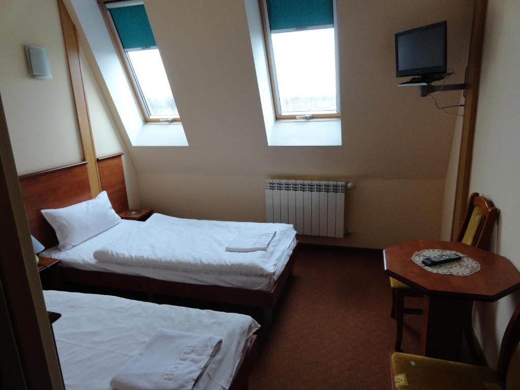 Posteľ alebo postele v izbe v ubytovaní Hotel Wielkopolanka