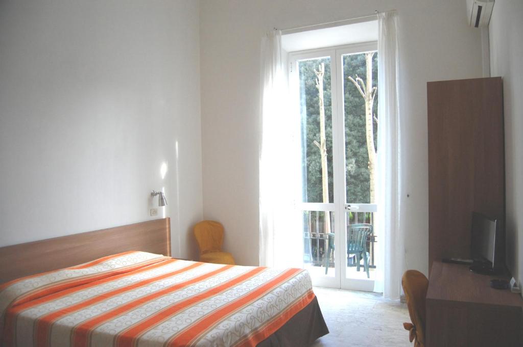 Postel nebo postele na pokoji v ubytování Hotel Derna