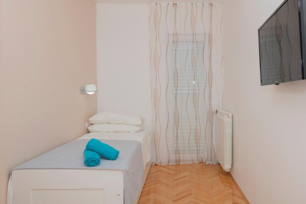 Posteľ alebo postele v izbe v ubytovaní Apartments Radeljić