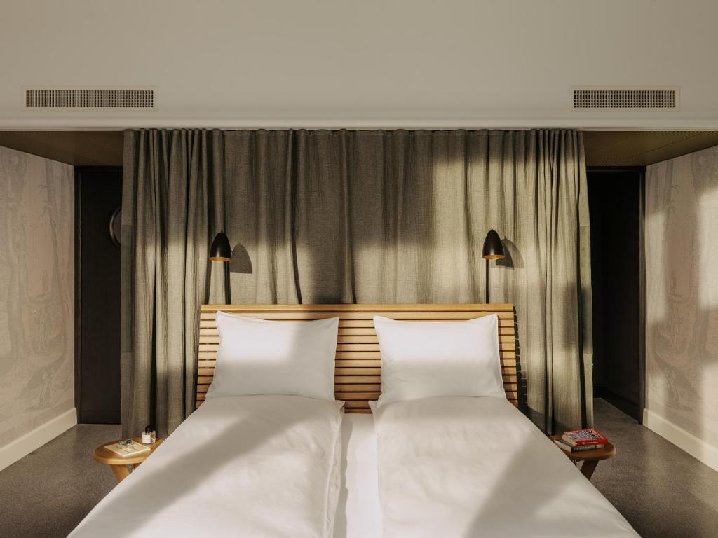 Voodi või voodid majutusasutuse Boutique & Design Hotel Volkshaus Basel toas