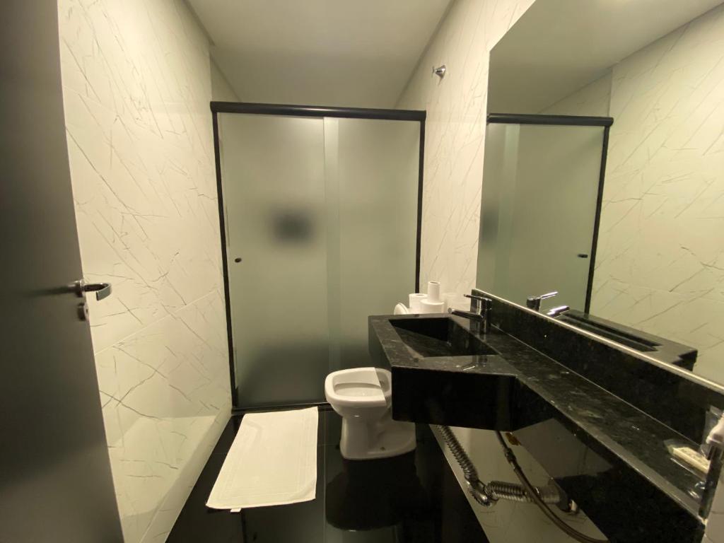 Koupelna v ubytování Mayná Hotel Prudentópolis Centro