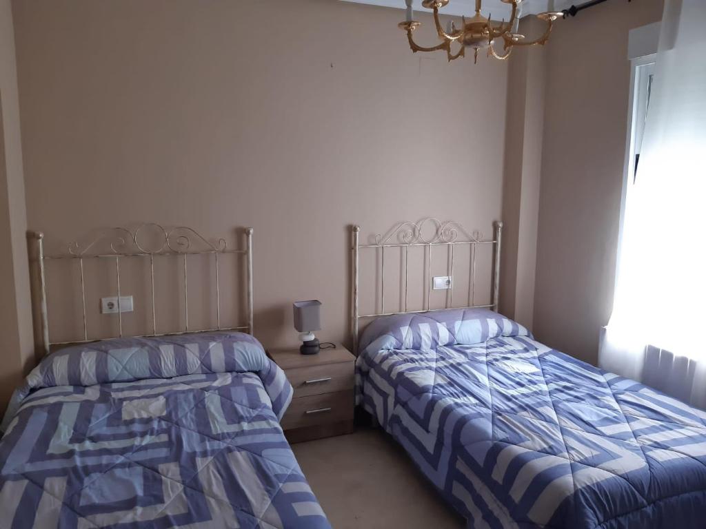 Postel nebo postele na pokoji v ubytování Calle Quevedo, 27 Apartamento. Feria