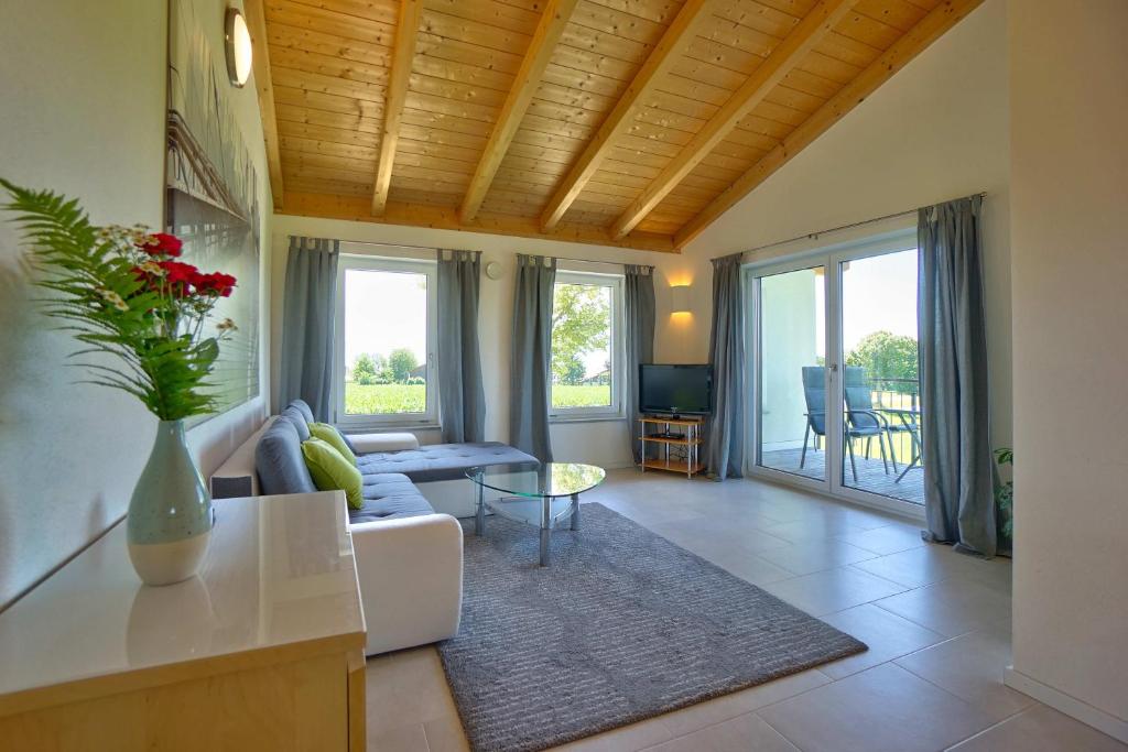 a living room with a couch and a table at Ferienwohnung Stocker in Seebruck