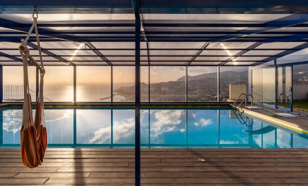 a swimming pool with a view of the mountains at Relax View in Funchal