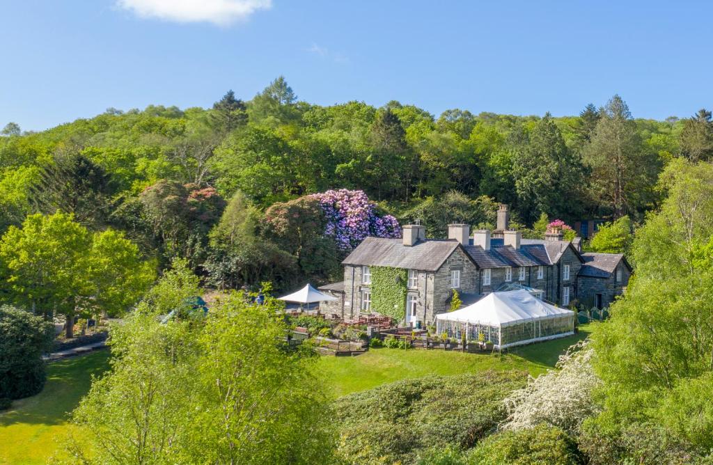 an aerial view of a house with a garden at Aberdunant Hall Holiday Park in Porthmadog