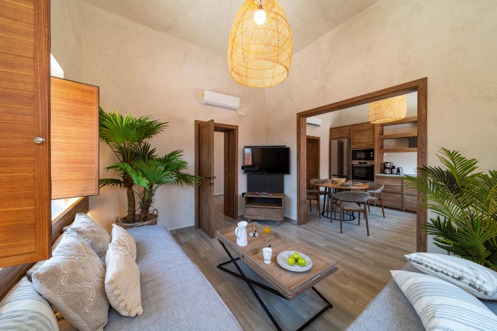 a living room with a couch and a table at Anastasia Grand Villa in Kattavía