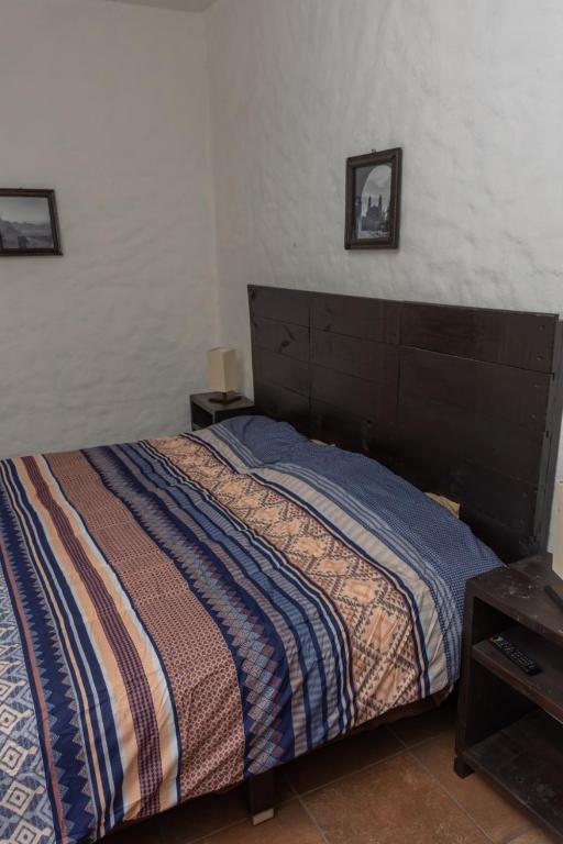 Letto o letti in una camera di Hostal Maria Tepozteca
