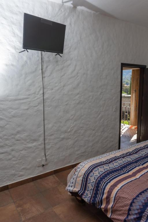 Letto o letti in una camera di Hostal Maria Tepozteca