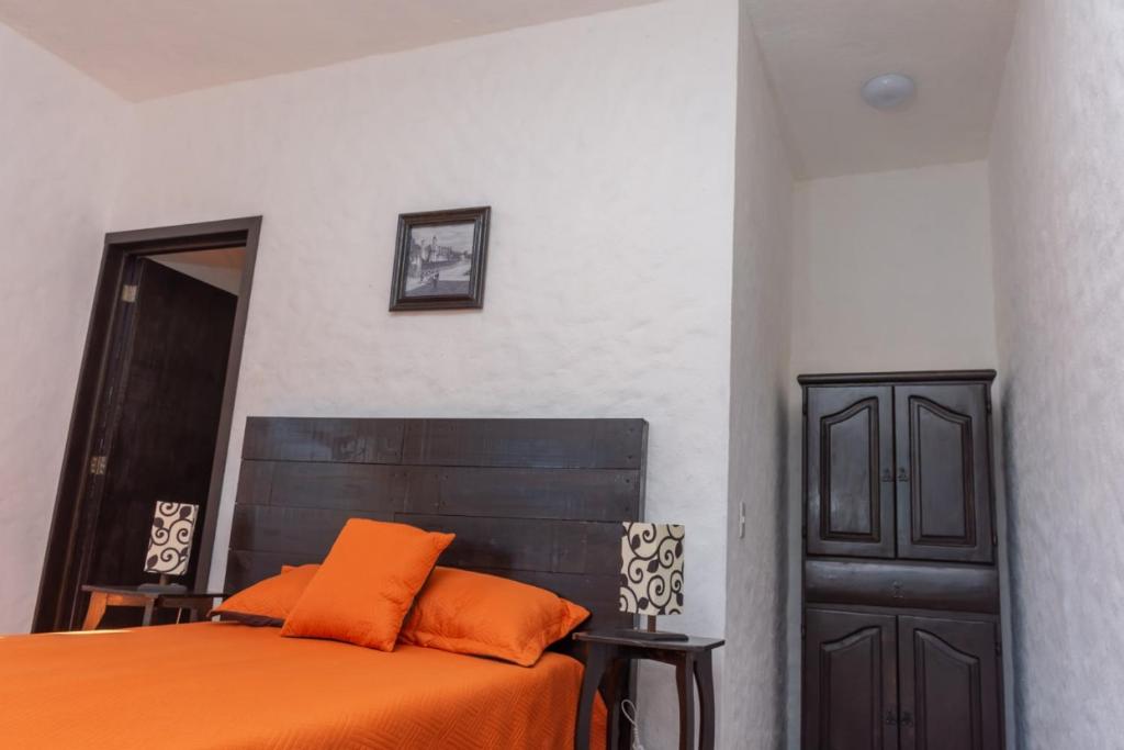 Letto o letti in una camera di Hostal Maria Tepozteca