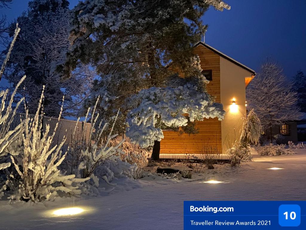 a cabin in the snow at night at Tiny Vacation in Písek