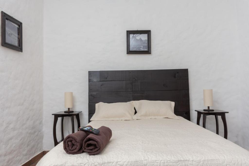Letto o letti in una camera di Hostal Maria Tepozteca