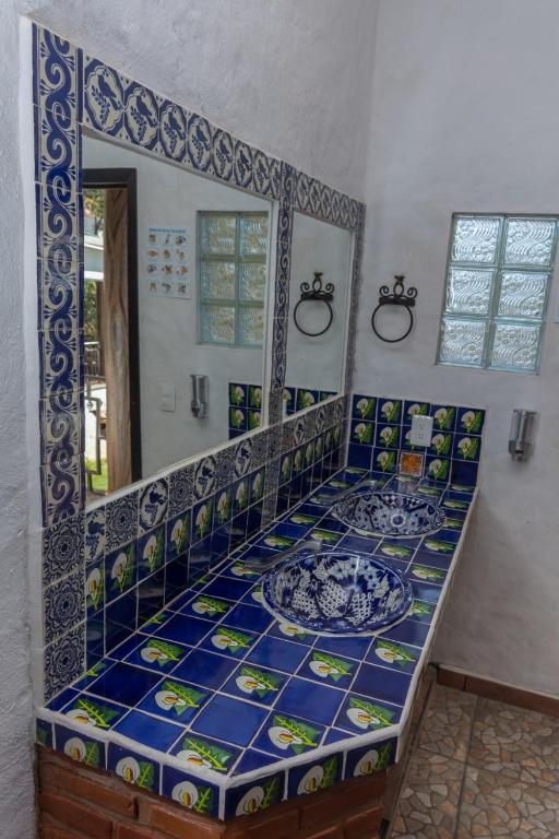 Letto o letti in una camera di Hostal Maria Tepozteca