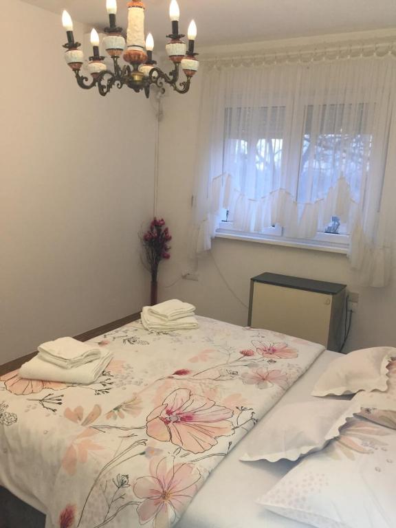 Postel nebo postele na pokoji v ubytování Apartman Hakuna Matata