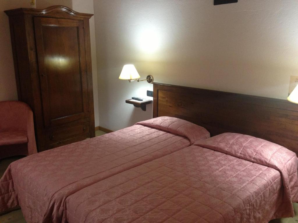 Postel nebo postele na pokoji v ubytování Agriturismo Al Casale