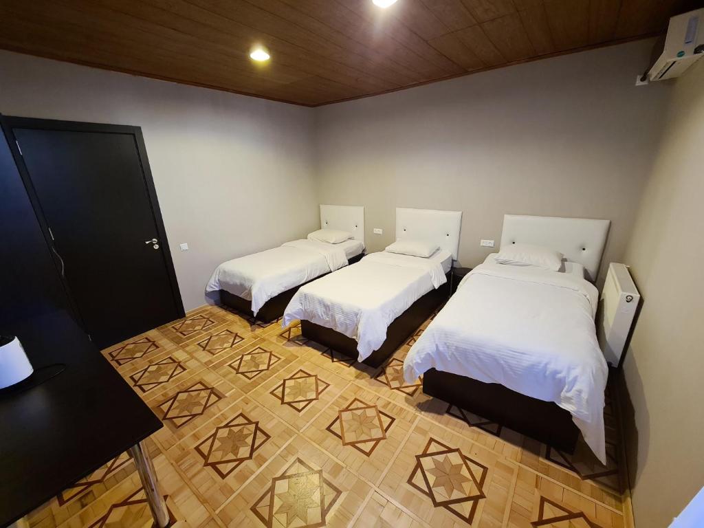 Postel nebo postele na pokoji v ubytování Chveni sakhli