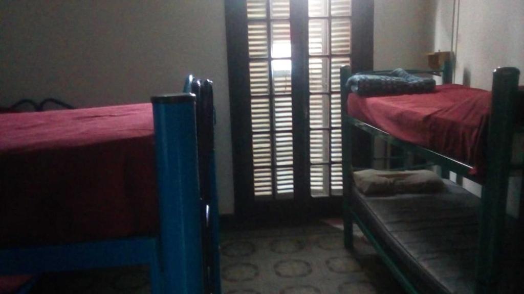Postel nebo postele na pokoji v ubytování Rivera Hostel Córdoba