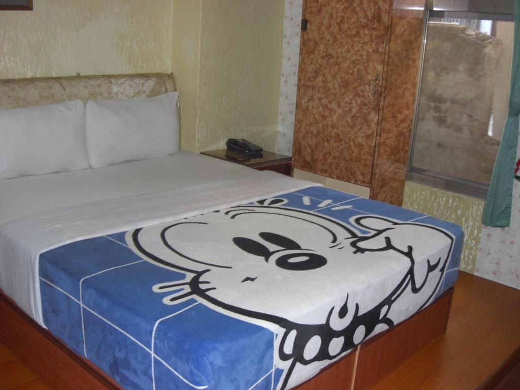 Postel nebo postele na pokoji v ubytování Uni Hotel