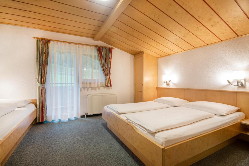 Postel nebo postele na pokoji v ubytování Apartpension Kappacher