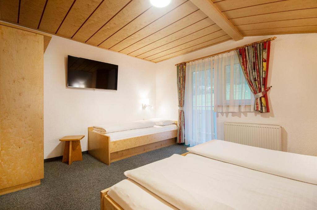 Postel nebo postele na pokoji v ubytování Apartpension Kappacher