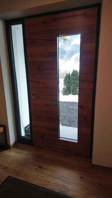 a room with a wooden door with a window at Ferienhaus Reiter Jochberg bei Kitzbühel in Jochberg