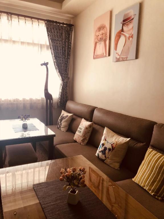 a living room with a couch and a table at Redbean Guesthouse in Wujie