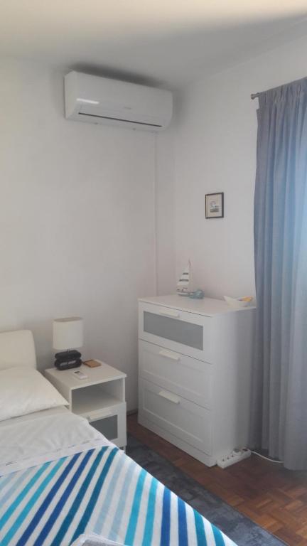 Postel nebo postele na pokoji v ubytování apartman-maja-krk