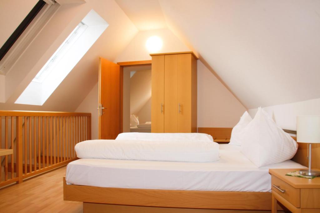 Postel nebo postele na pokoji v ubytování Raiffeisenhof Appartements