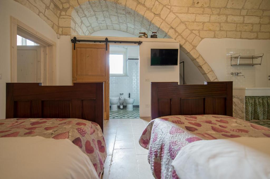 Łóżko lub łóżka w pokoju w obiekcie Ai Cappuccini Guest House