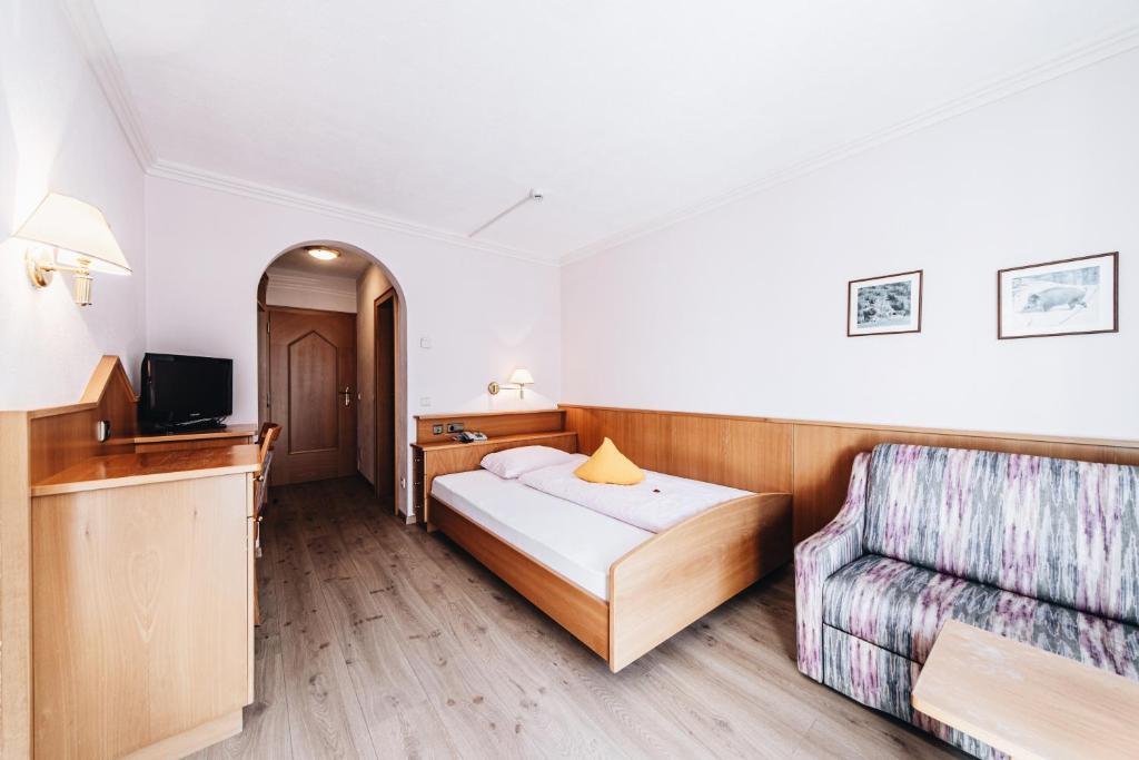 Postel nebo postele na pokoji v ubytování Hotel Ranuimüllerhof