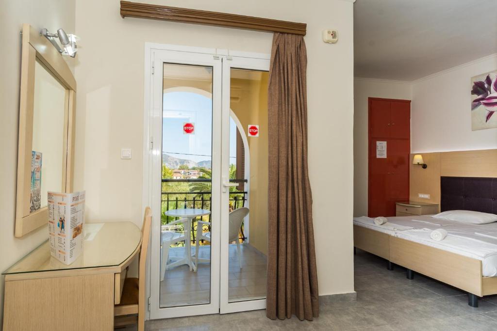 Postel nebo postele na pokoji v ubytování Rose Club Apartments