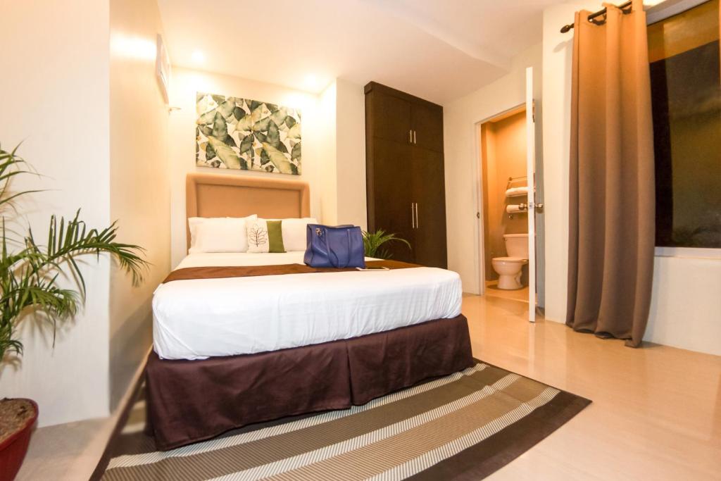 Postel nebo postele na pokoji v ubytování Verovino Suites
