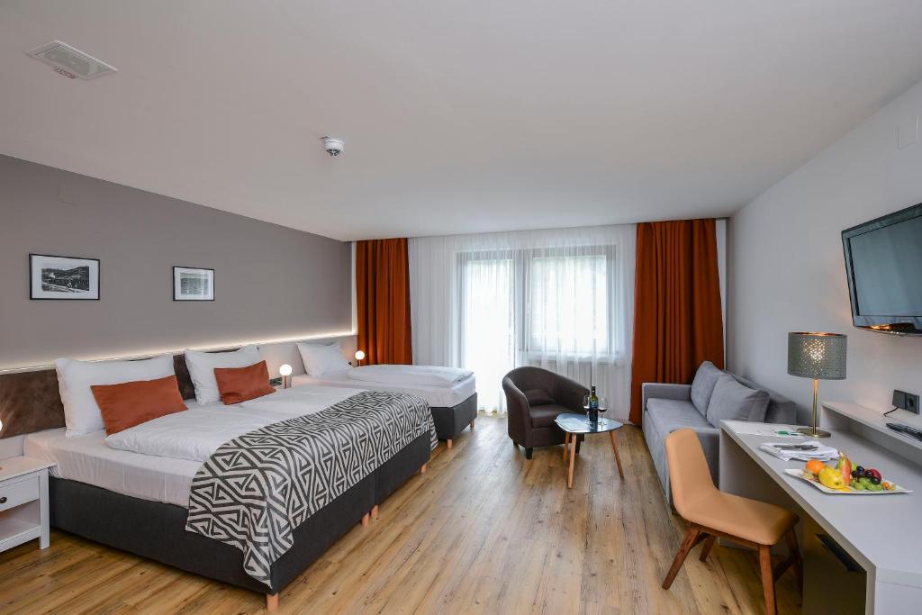 Postel nebo postele na pokoji v ubytování Hotel Alpenblick Kreischberg