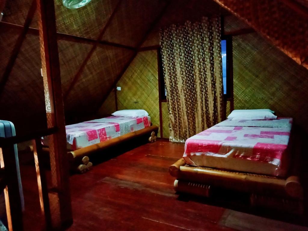 Ένα ή περισσότερα κρεβάτια σε δωμάτιο στο Allba's Homestay
