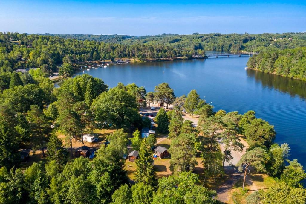 an aerial view of a lake with a park at Camping du Lac in Marcillac-la-Croisille