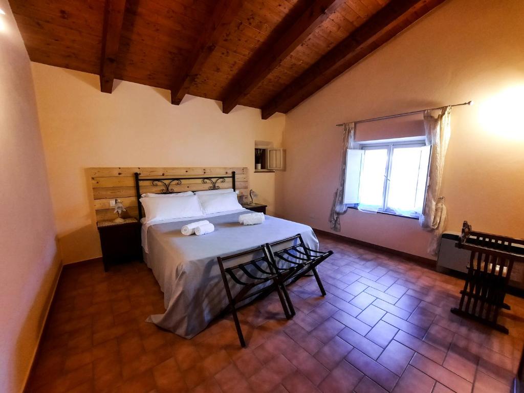Posteľ alebo postele v izbe v ubytovaní Agriturismo Tenuta Adamo