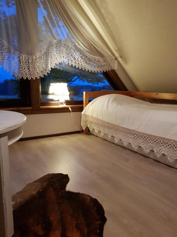 Postel nebo postele na pokoji v ubytování Maamehe golfi talu