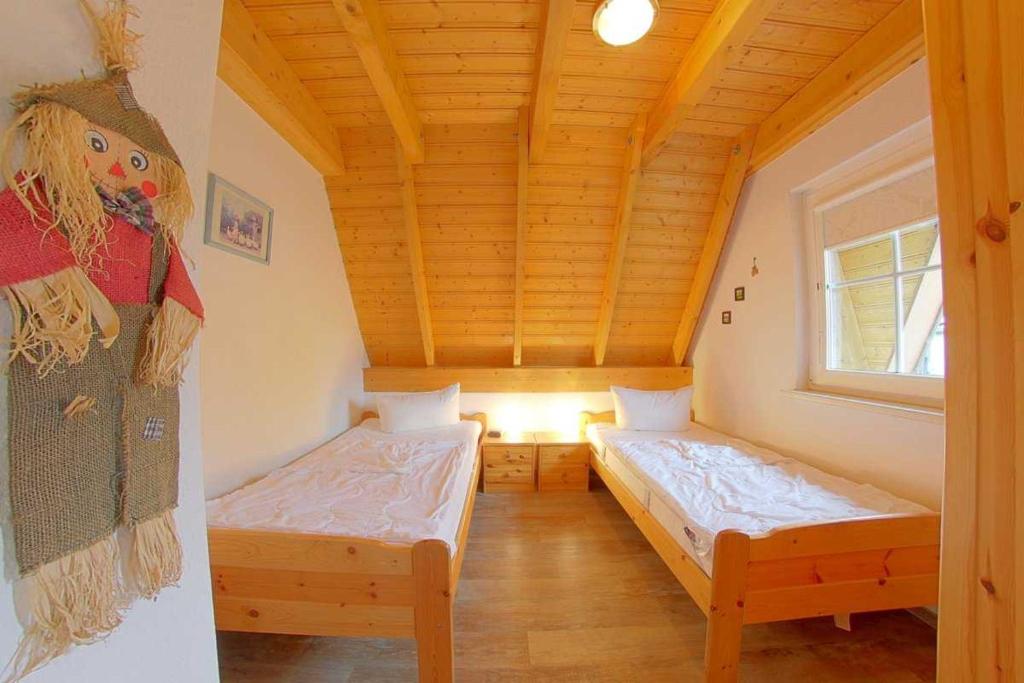 Postel nebo postele na pokoji v ubytování Strandvogt 3 KN3