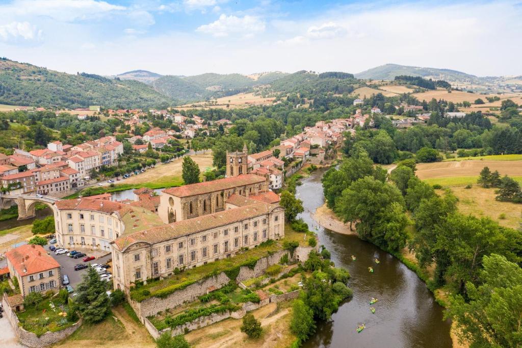 an aerial view of a town with a river at Camping de la Bageasse in Brioude