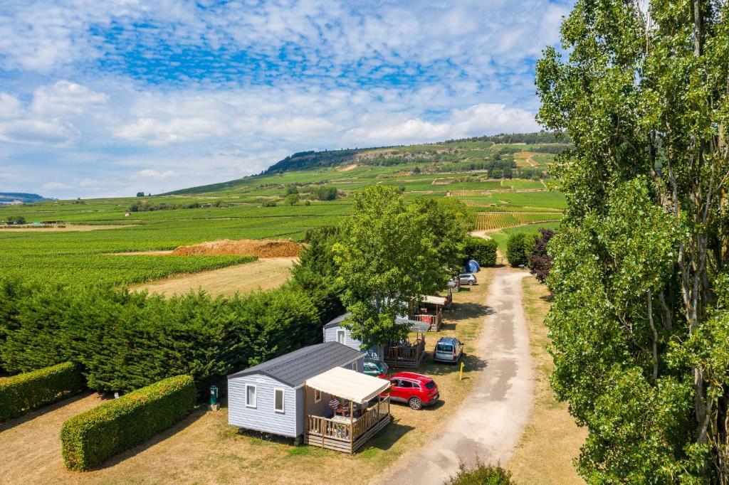 an aerial view of a tiny house and a truck at Camping de Santenay in Santenay