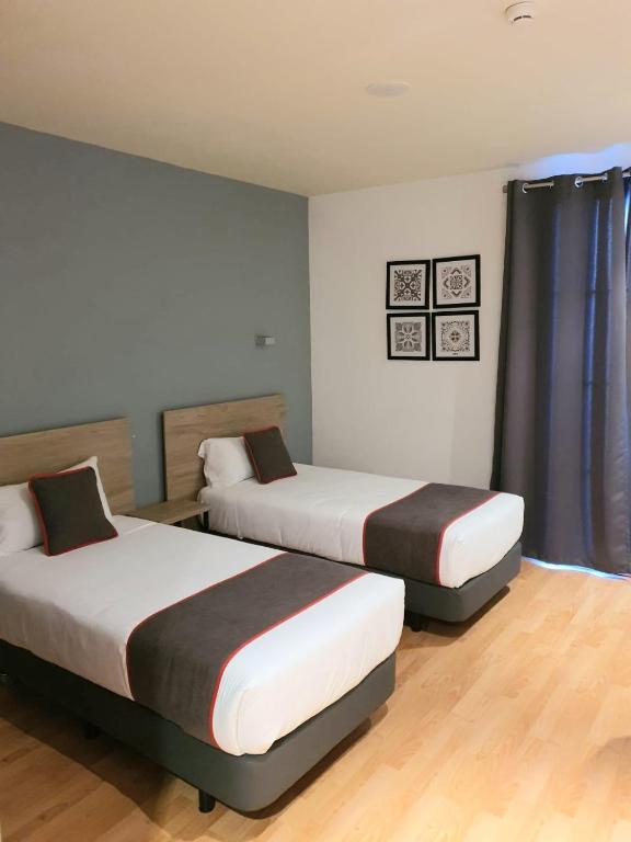 Postel nebo postele na pokoji v ubytování Hospedium Hotel Vittoria Colonna